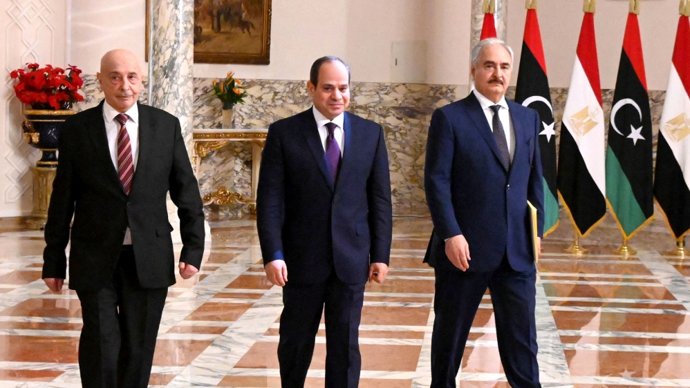 A handout picture released by the Egyptian Presidency on June 6, 2020 shows Egyptian President Abdel Fattah al-Sisi (C), Libyan commander Khalifa Haftar (R) and the Libyan Parliament speaker Aguila Sa