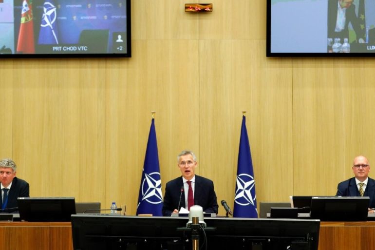 NATO Secretary-General Jens Stoltenberg (C) chairs a NATO defence ministers meeting via teleconference at the Alliance headquarters in Brussels, on June 17, 2020. FRANCOIS LENOIR / POOL / AFP