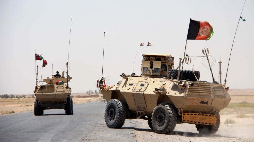 Afghan security officials patrol highway in Helmand, Afghanistan, 14 June 2020. Although clashes between the Afghan security forces and the Taliban fighters continued in rural areas, attacks in cit