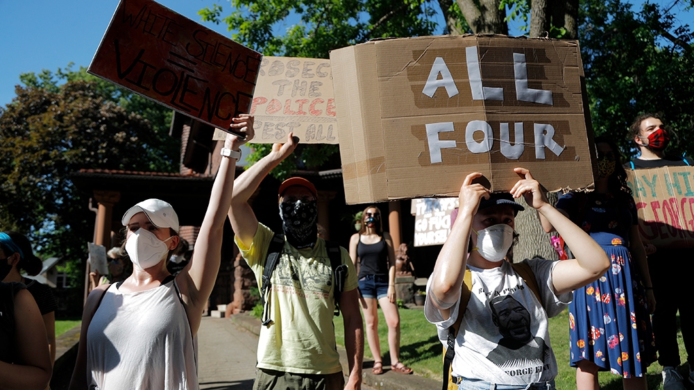 Demonstrators gather at the Minnesota governor's mansion Monday, June 1, 2020, in St. Paul, Minn. Protests continued following the death of George Floyd, who died after being restrained by Minneapolis
