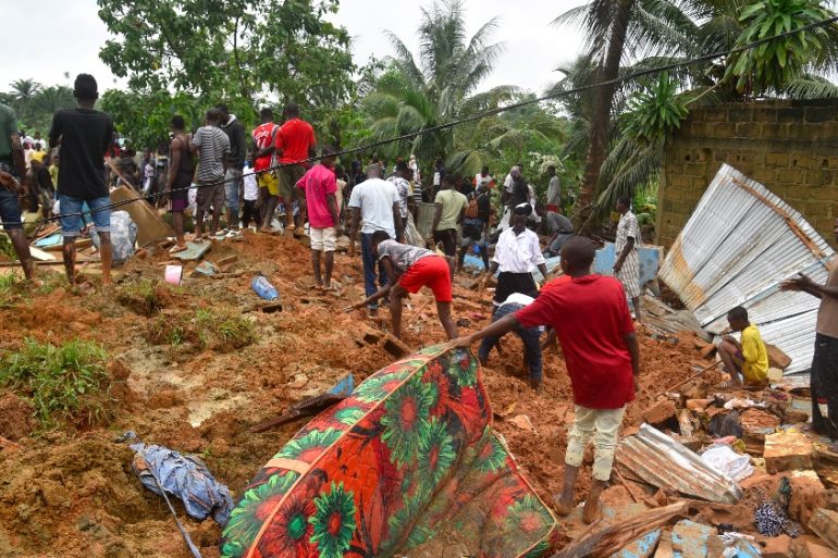 ICOAST-ACCIDENT-LANDSLIDE People search for survivors and bodies on the site of a landslide that killed 13 people on June 18, 2020 in Anyama, near Abidjan.