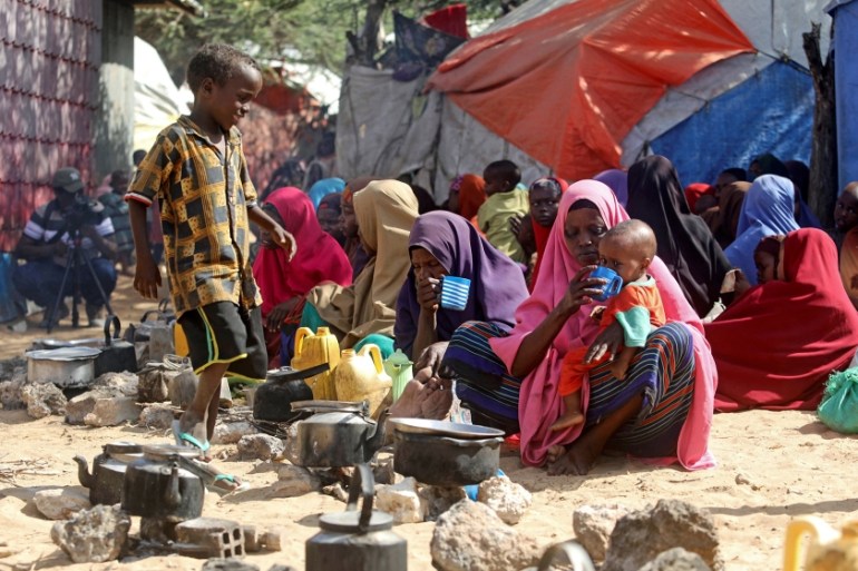 Somali families, displaced after fleeing the Lower Shabelle region amid an uptick in U.S. airstrikes, wait at an IDP (internally displaced person) camp near Mogadishu, Somalia March 12, 2020. Picture