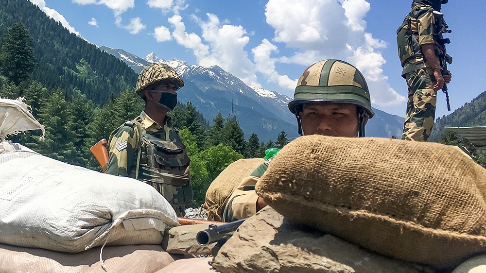 Indian Border Security Force (BSF) soldiers guard a highway leading towards Leh, bordering China, in Gagangir on June 17, 2020. - 