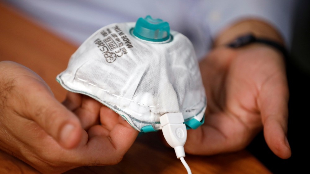An Israeli researcher, part of a team which say they have invented a reusable face mask that can disinfect itself and kill the coronavirus disease (COVID-19), 