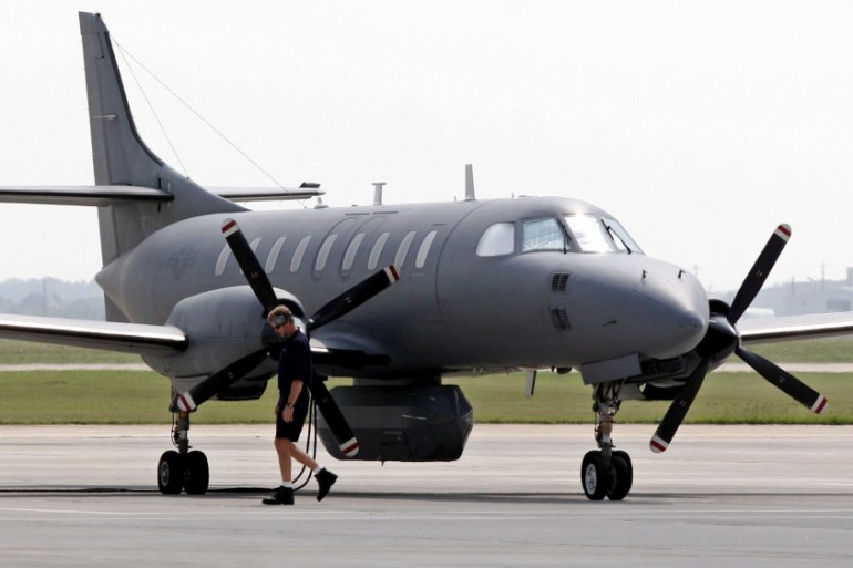 A technician checks a RC-26 of the 147th Fighter Wing that sits on the tarmac of Ellington Field, Houston, TX. The RC-26 while primarily used for counter drug missions has been flying photo missions o