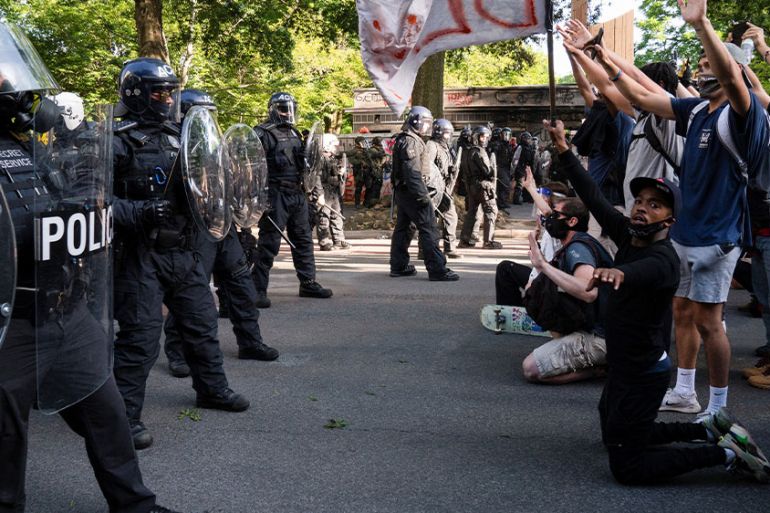Protesters face off with riot police at Lafayette Park