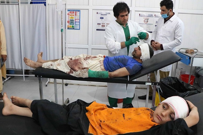 epa08560874 Afghans who were injured in an alleged airstrike by Afghan security forces on suspected Taliban hideouts in Gozara district, receive medical treatment after they were brought to a hospital