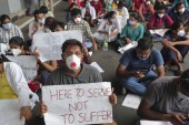 Junior doctors from Government Gandhi Hospital protest outside the hospital, demanding action against the attack on a colleague in Hyderabad, India on June 10, 2020  [File: AP/Mahesh Kumar A]