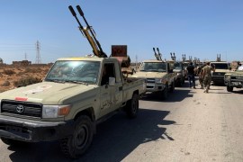 Troops loyal to Libya''s internationally recognized government are seen in military vehicles as they prepare before heading to Sirte