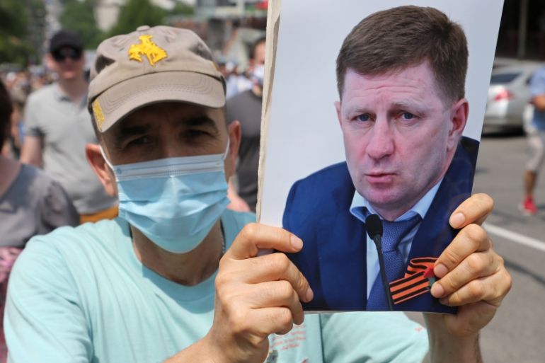 People take part in a rally in support of arrested governor Sergei Furgal in Khabarovsk