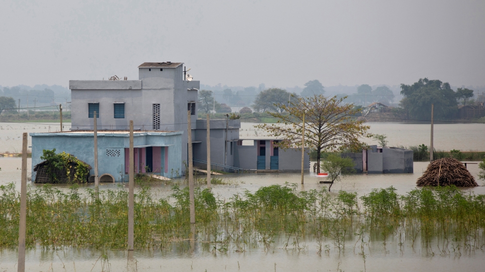A partially submerged government building is seen in a flooded area in Bhagalpur district