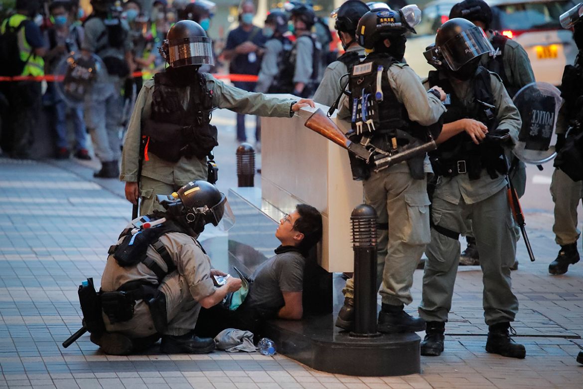 Police detained a protester during a march marking the anniversary of the Hong Kong handover from Britain to China, Wednesday, July. 1, 2020, in Hong Kong. Hong Kong marked the 23rd anniversary of its
