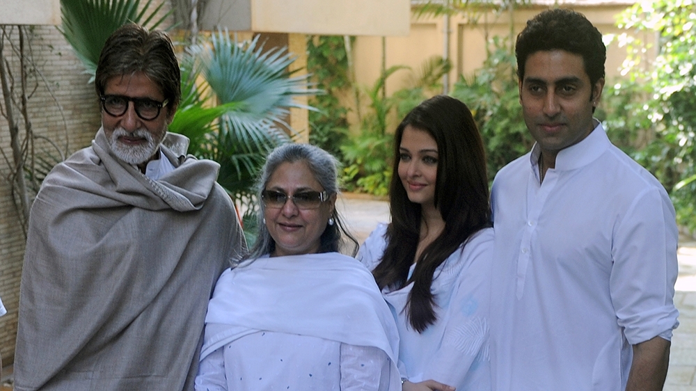 Indian Bollywood actor Amitabh Bachchan (L), accompanied by wife Jaya (2nd L) and son Abhishek (R) with wife Aishwarya Rai Bachchan (2nd R) pose following a press conference in Mumbai on February 9, 2