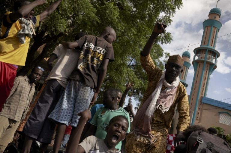 Protesters gather in front of the Salam mosque of Badalabougou, where the influent Imam Mahmoud Dicko led a prayer dedicated to the victims of the clashes of the past two days in Bamako