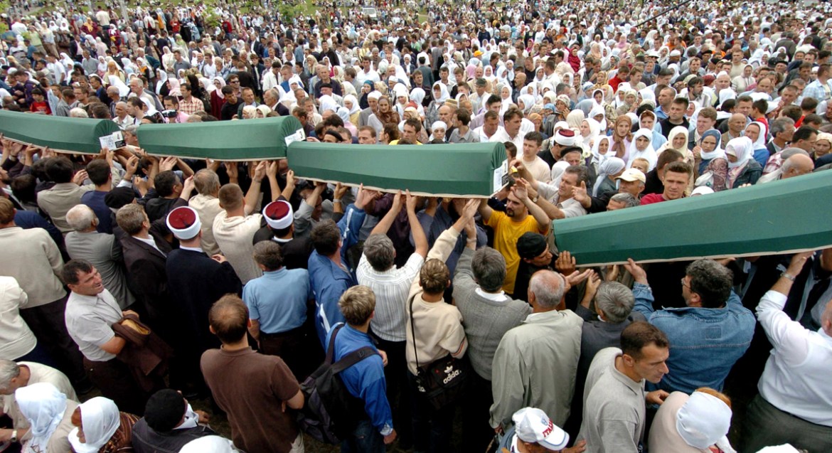 Bosnian Muslim men carry the 610 coffins to be buried at the Memorial cemetery in Potocari, near the eastern Bosnian town of Srebrenica 11 July 2005, where 610 victims of the 1995 Srebrenica massacre