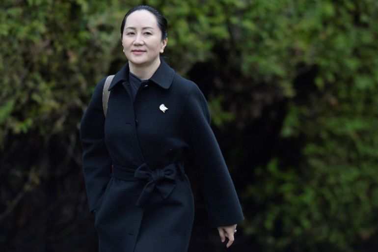 Huawei CFO Meng leaves her home to attend her extradition hearing in Vancouver