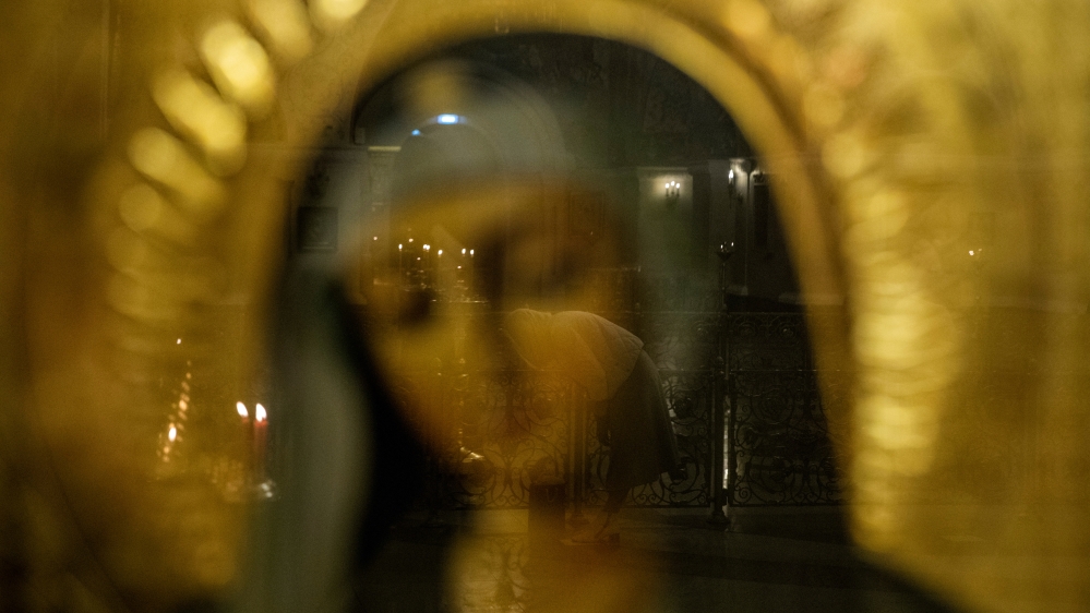 An Orthodox Christian attends a service in a church in Moscow