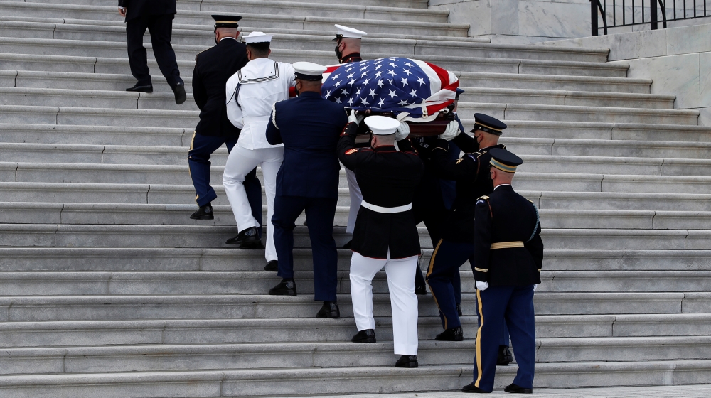 The flag-draped casket of late Rep. John Lewis, (D-GA), is carried by a joint services military honor guard to lie in state at the U.S. Capitol, in Washington, U.S., July 27, 2020. Alex Brandon/Pool v