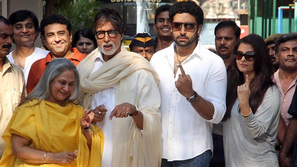 Bollywood actor Amitabh Bachchan second from left, poses with wife Jaya left son Abhishek Bachchan second from right and his wife Aishwarya Rai Bachchan right after casting their votes at a polling st
