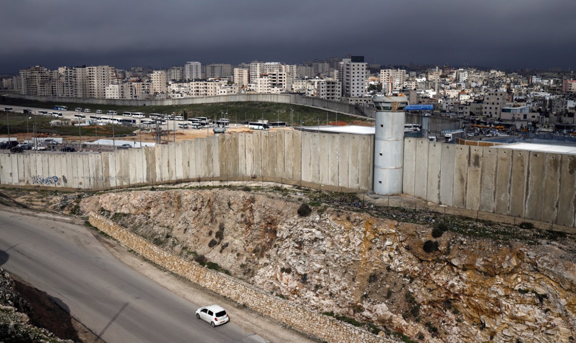 This picture taken on January 17, 2019 from the Palestinian West Bank village of Al-Ram (foreground) shows the controversial Israeli separation barrier separating East Jerusalem (C-L) and the Palestin