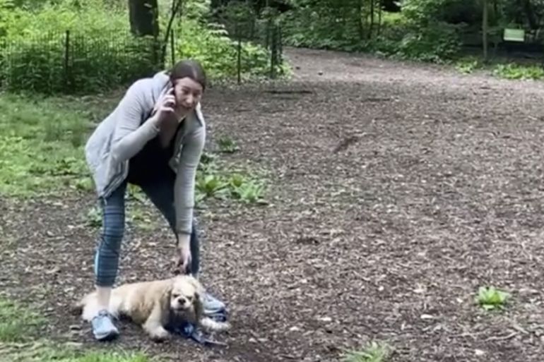 This image made from Monday, May 25, 2020, video provided by Christian Cooper shows Amy Cooper with her dog calling police at Central Park in New York. A video of a verbal dispute between Amy Cooper,