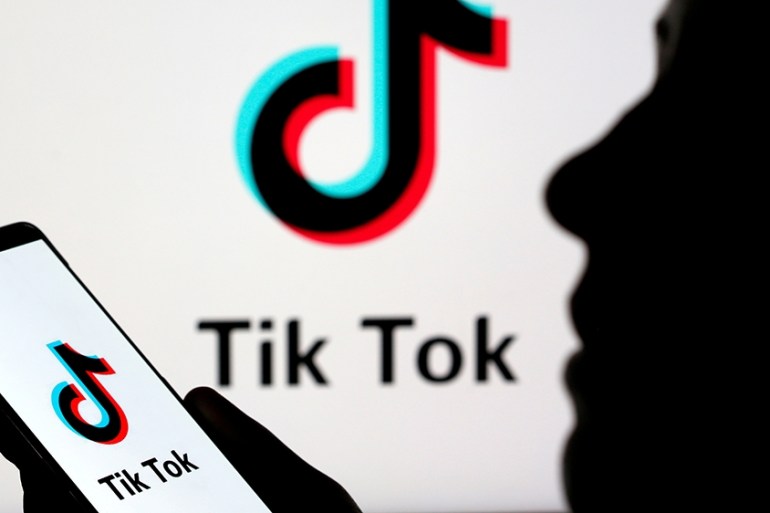 FILE PHOTO: A person holds a smartphone with Tik Tok logo displayed in this picture illustration taken November 7, 2019. Picture taken November 7, 2019. REUTERS/Dado Ruvic/Illustration/File Photo