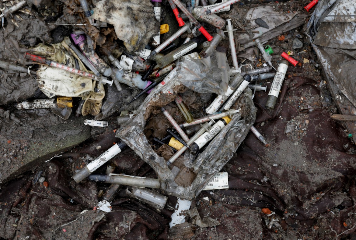 Discarded syringes lie amongst other bits of disposed medical waste at a landfill site, during the coronavirus disease (COVID-19) outbreak, in New Delhi, India, July 22, 2020. REUTERS/Adnan Abidi