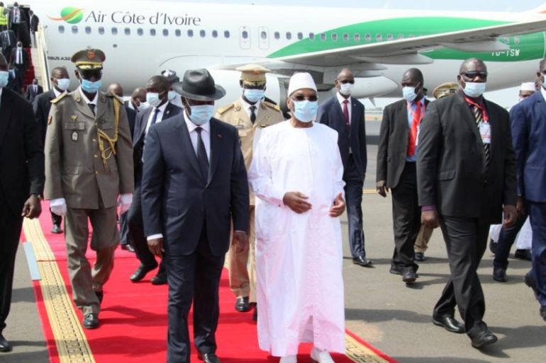 Mali''s President Ibrahim Boubacar Keita walks with Ivory Coast President Alassane Ouattara in Bamako