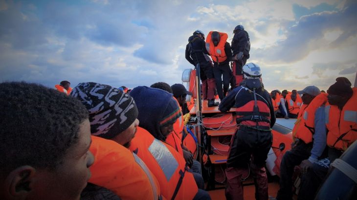 Migrants wearing lifejackets are seen during a rescue operation by the MSF-SOS Mediterranee-run Ocean Viking rescue ship, off the coast of Libya in the Mediterranean Sea