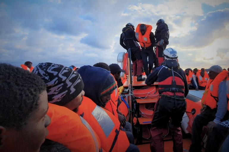 Migrants wearing lifejackets are seen during a rescue operation by the MSF-SOS Mediterranee-run Ocean Viking rescue ship, off the coast of Libya in the Mediterranean Sea