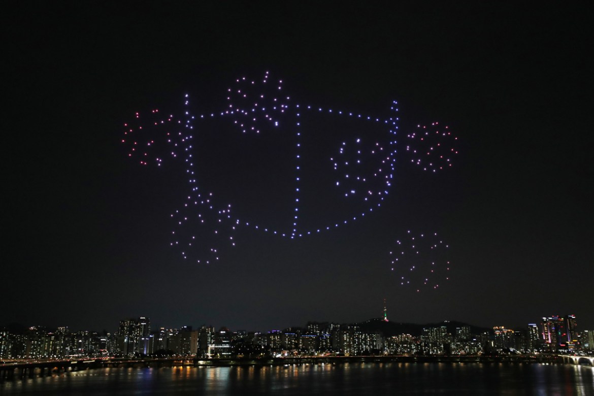Drones fly over the Han river showing messages to support the country as a measure to avoid the spread of the coronavirus disease (COVID-19) continues in Seoul, South Korea, July 4, 2020. Picture take