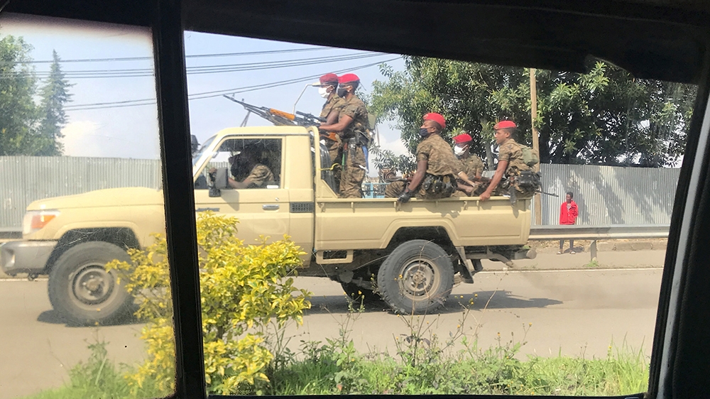 Ethiopian military ride on their pick-up truck as they patrol the streets following protests in Addis Ababa, Ethiopia July 2, 2020. REUTERS/Tiksa Negeri