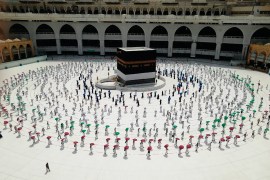 Hundreds of Muslim pilgrims circle the Kaaba, the cubic building at the Grand Mosque, as they observe social distancing to protect themselves against the coronavirus, in the Muslim holy city of Mecca,