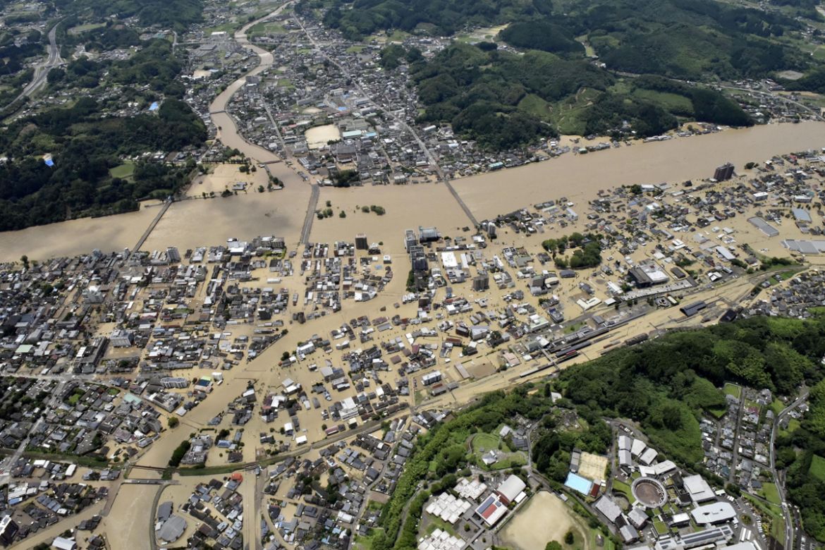An aerial view shows flooded Kuma River caused by heavy rain at a residential area in Hitoyoshi, Kumamoto prefecture, southern Japan, in this photo taken by Kyodo July 4, 2020. Mandatory credit Kyodo/