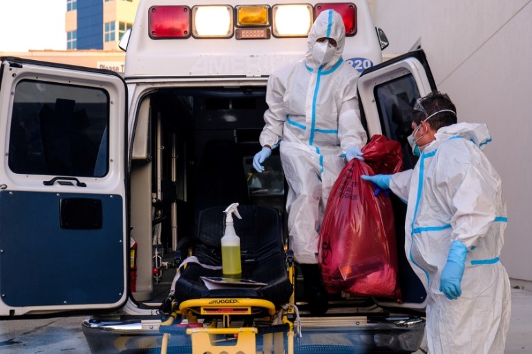 EMTs cleanse their materials outside Memorial West Hospital where coronavirus disease (COVID-19) patients are treated, in Pembroke Pines, Florida, U.S. July 13, 2020. REUTERS/Maria Alejandra Cardona