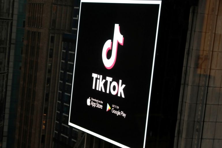 The TikTok logo is seen on a screen over Times Square in New York City