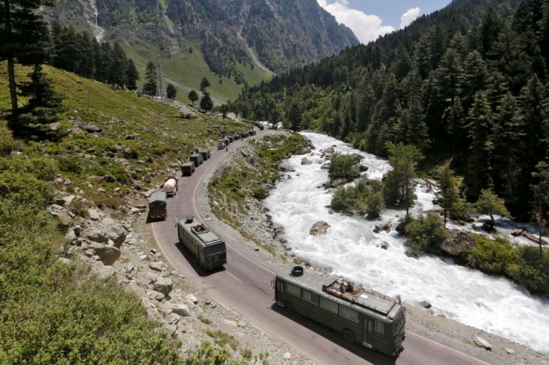 Indian Army convoy moves along a highway leading to Ladakh, at Gagangeer