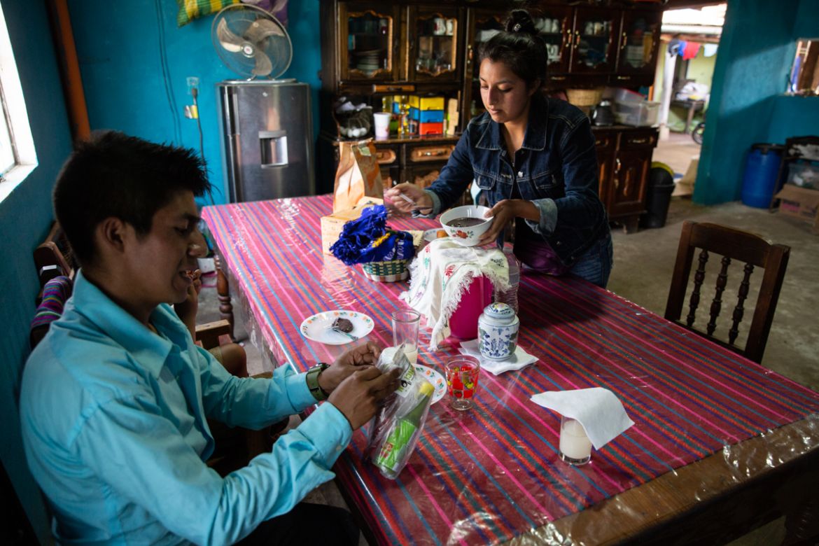 Teacher Gerardo Ixcoy and his wife Yessika Lopez prepare to have lunch in their home in Santa Cruz del Quiche, Guatemala, Wednesday, July 15, 2020. "One day the mother of a student told me they didn''t