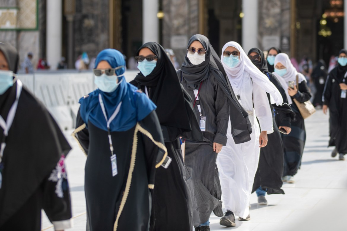 Muslim pilgrims wearing protective face masks arrive to circle the Kaaba at the Grand mosque during the annual Haj pilgrimage amid the coronavirus disease (COVID-19) pandemic, in the holy city of Mecc