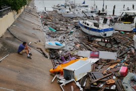 Allen Heath surveys the damage to a private marina after it was hit by Hurricane Hanna, Sunday, July 26, 2020, in Corpus Christi, Texas. Heath''s boat and about 30 others were lost or damaged. (AP Phot