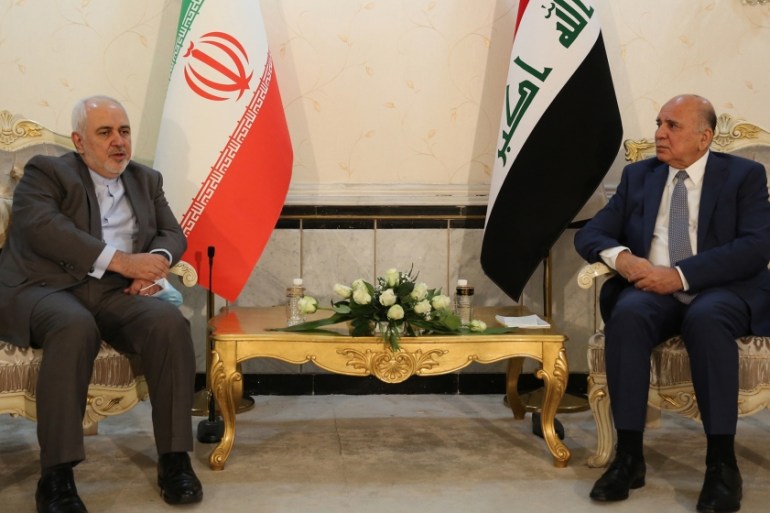 Iranian Foreign Minister Mohammad Javad Zarif (L) meets with his Iraqi counterpart Fuad Hussein (R) in Baghdad, Iraq on July 19, 2020. (Photo by Murtadha Al-Sudani/Anadolu Agency via Getty Images)