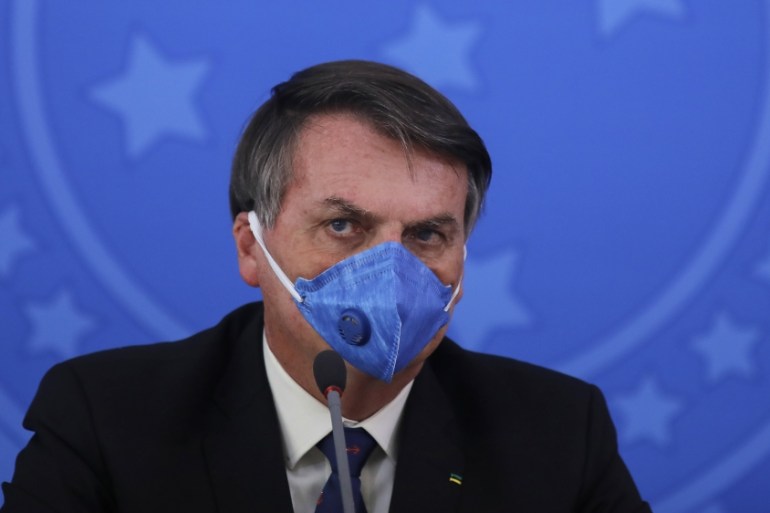 Brazil''s President Jair Bolsonaro wears a face mask during a press conference on the coronavirus pandemic COVID-19 at the Planalto Palace in Brasilia, Brazil. Brazilian President Jair Bolsonaro announ