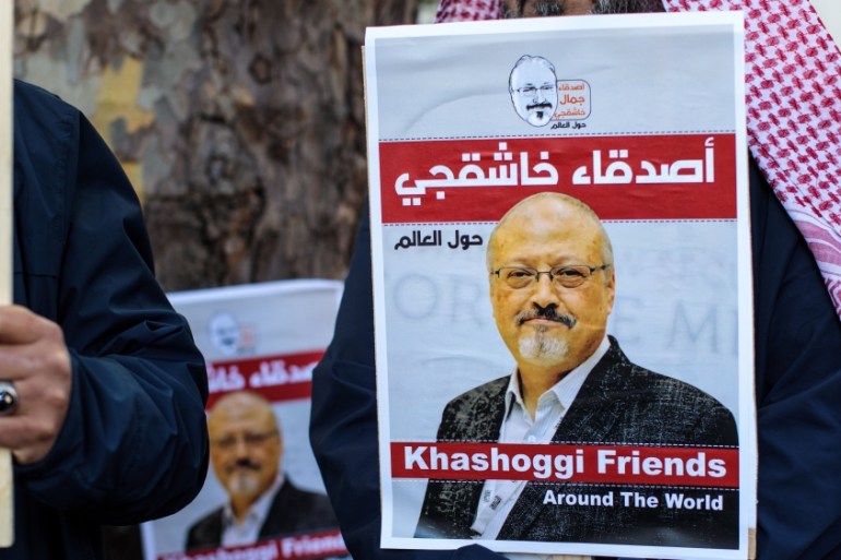 Protesters holding placards demonstrate against the killing of journalist Jamal Khashoggi outside the Saudi