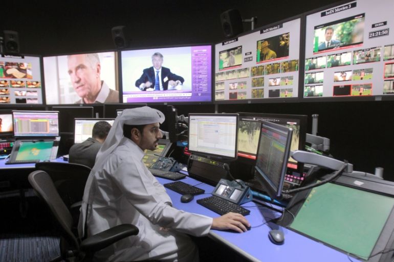 Employees work in a broadcast control room at the beIN Sports studio that will be hosting the 2022 FIFA World Cup in Doha