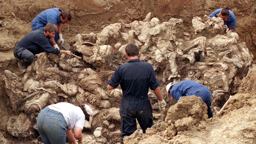 International forensic experts examine dozens of bodies in a mass grave in Pilice, September 18, 1996. Bosnia will mark the 25th anniversary of the massacre of more than 8,000 Bosnian Muslim men and b
