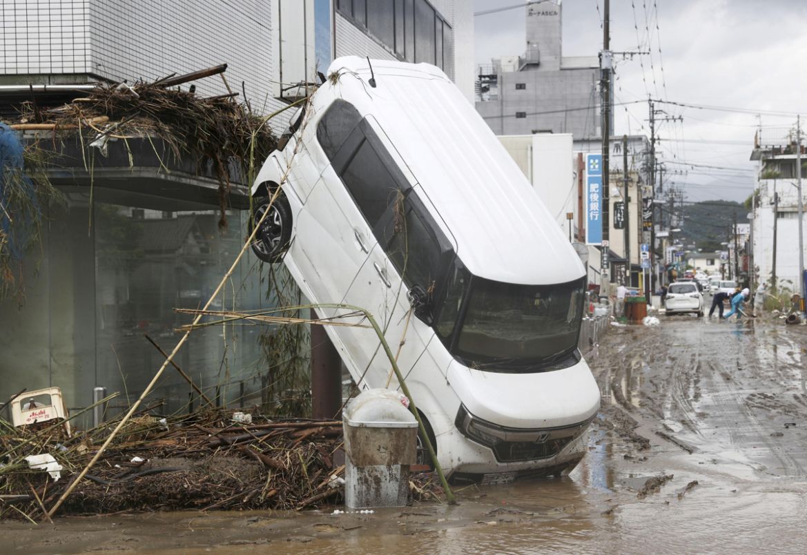 A car is pictured after it was drifted by torrential rain in Hitoyoshi, Kumamoto prefecture, southern Japan, in this photo taken by Kyodo July 6, 2020. Mandatory credit Kyodo/via REUTERS ATTENTION EDI