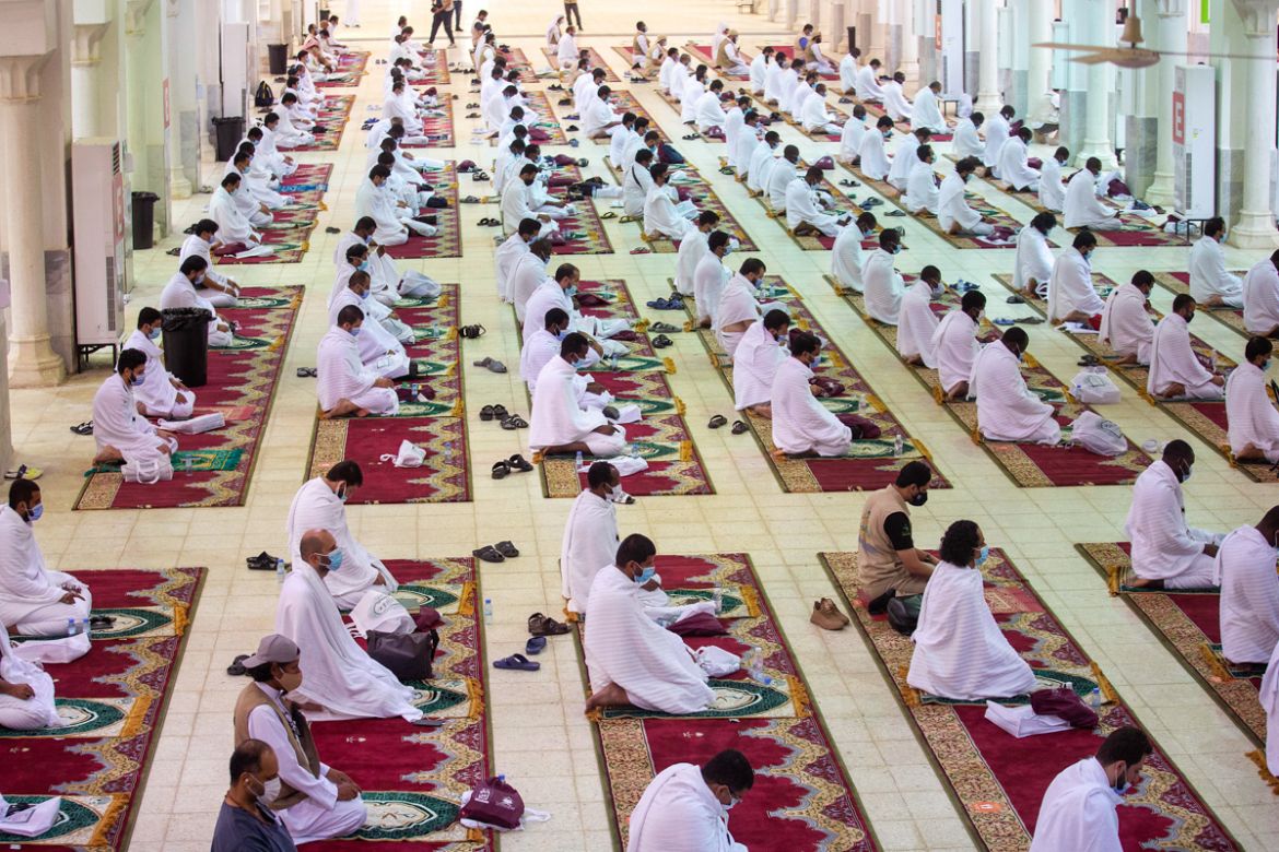 A handout picture provided by Saudi Ministry of Media, on July 30, 2020, shows Muslim pilgrims attending prayers at at Namira Mosque, on Arafat Day, the climax of the Hajj pilgrimage in Saudi Arabia''s