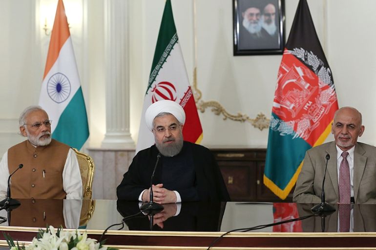 A handout picture provided by the office of Iranian President Hassan Rouhani on May 23, 2016 shows him (C) speaking in a joint press briefing with Indian Prime Minister Narendra Modi (L) and Afghan Pr