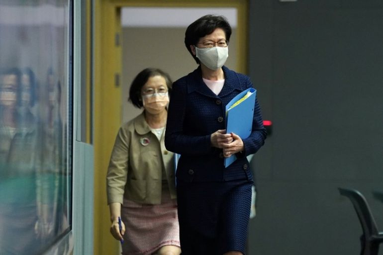 Hong Kong Chief Executive Carrie Lam, wearing a face mask following the coronavirus disease (COVID-19) outbreak, arrives for a news conference