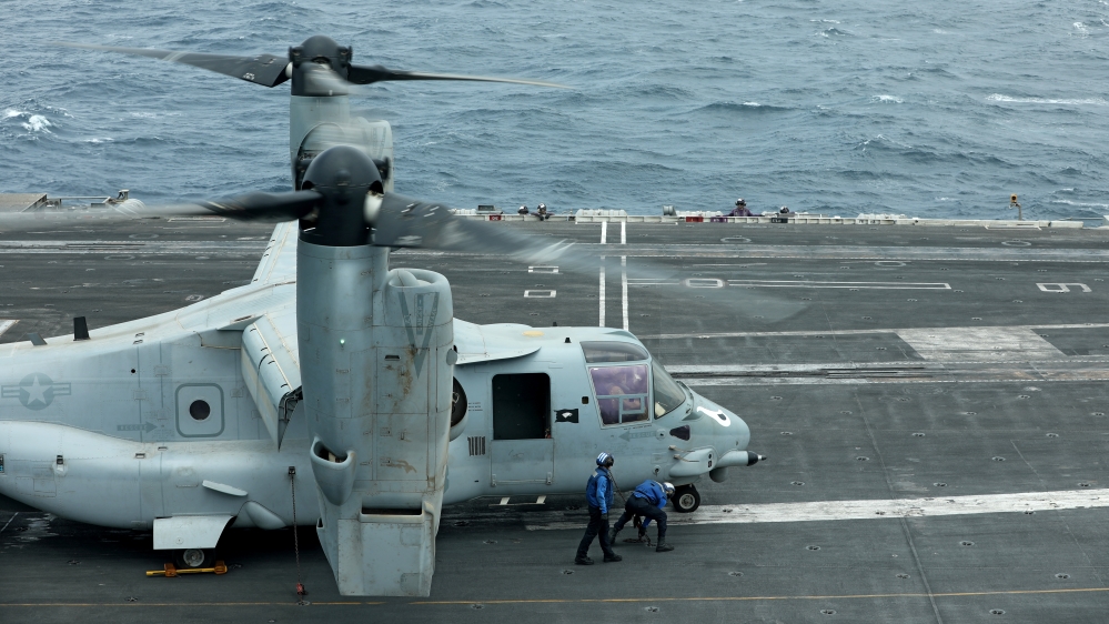 An MV-22 Osprey aircraft is seen on the deck of USS Abraham Lincoln in the Gulf of Oman near the Strait of Hormuz